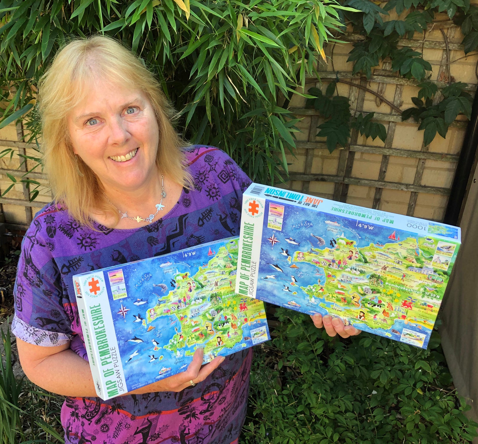 Artist Jane Tomlinson with her Pembrokeshire jigsaws