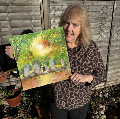 Artist Jane Tomlinson with her painting 'Wayland's Smithy Magic' of an ancient Oxfordshire long barrow